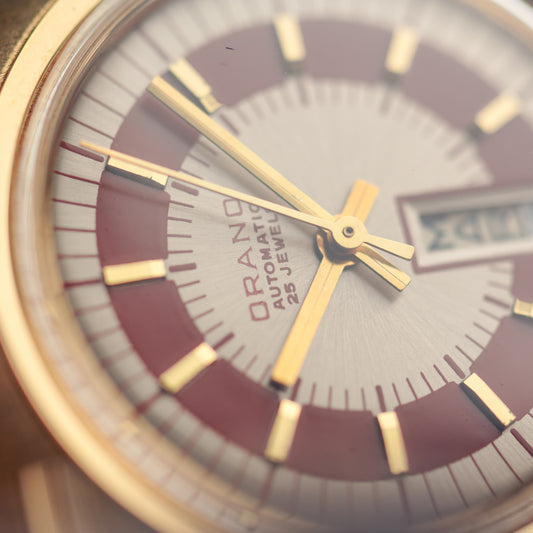 Orano Day Date rouge NOS